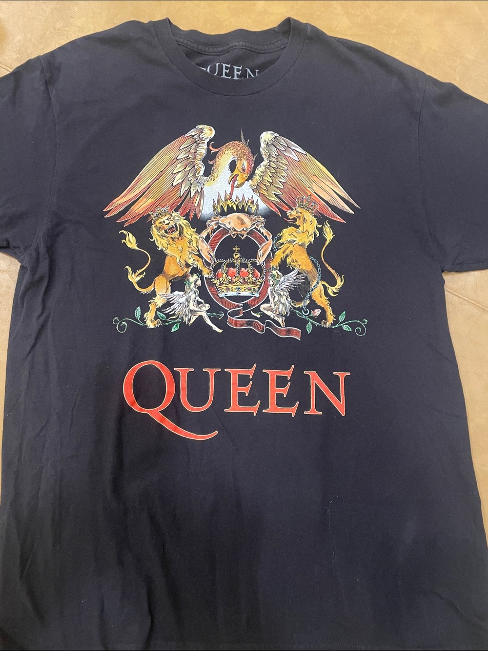 Queen T with bold strong graphics on a rich black t shirt. A sought after tshirt
